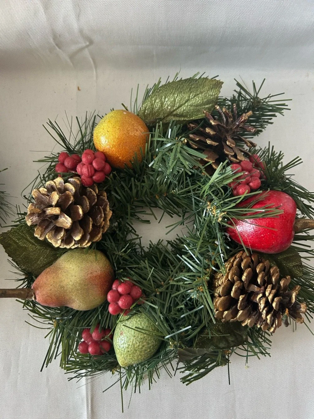 VTG artificial wreath/candle ring w/faux fruit, pinecones, and red berries.